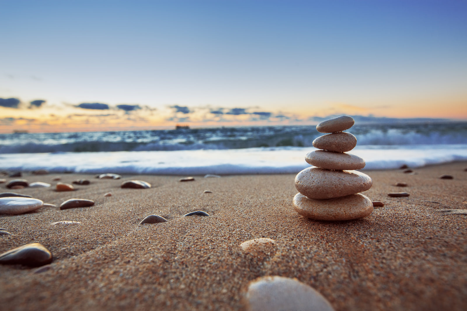 Zen picture of stones piled up on the seashore